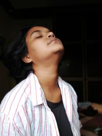 Portrait of a beautiful young woman looking away