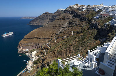 High angle view of buildings by sea against sky