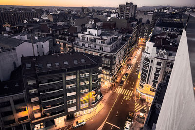 High angle view of illuminated cityscape against sky