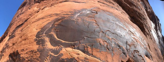 Low angle view of rock formation against sky