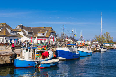 Boats moored at harbor