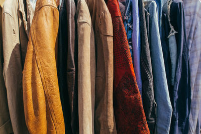 Close-up of shirts hanging in market stall for sale