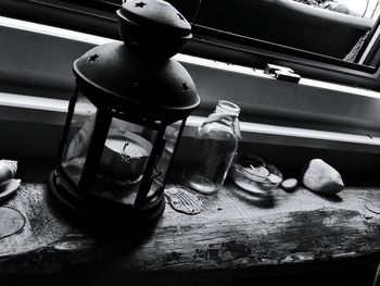 High angle view of drinking glass in jar on table