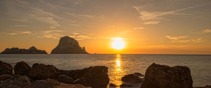 Scenic view of sea against sky during sunset