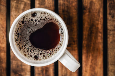 Directly above shot of coffee cup on table