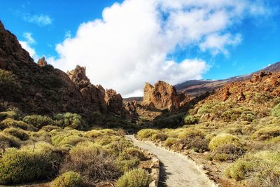 Panoramic view of road amidst mountains against sky