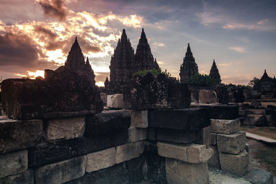 Exterior of temple against sky during sunset