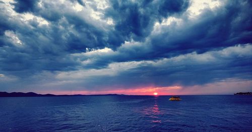 Scenic view of sea against sky at sunset