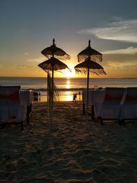 Scenic view of beach against sky during sunset