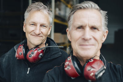 Close-up portrait of male workers in industry