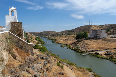 Panoramic view of buildings and mountains against sky