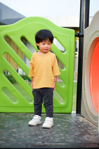 Portrait of boy standing in boat
