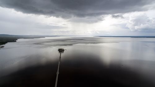 Scenic reflection of clouds in calm sea