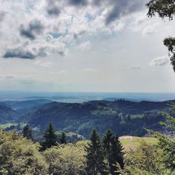 Scenic view of landscape against cloudy sky