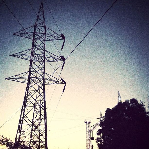 power line, electricity pylon, low angle view, electricity, power supply, cable, connection, technology, fuel and power generation, silhouette, clear sky, sky, power cable, dusk, outdoors, electricity tower, built structure, blue, complexity, no people