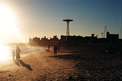 Silhouette of woman at sunset