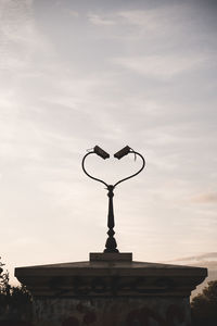 Low angle view of sculpture against building