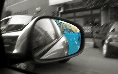 Reflection of car on side-view mirror