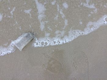 High angle view of bubbles on beach