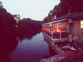 Boats moored in river