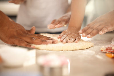 Cropped hand of person preparing food