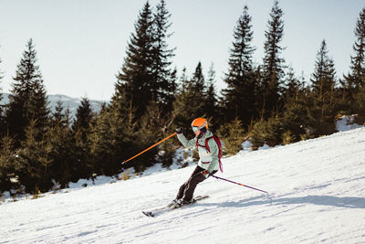 Full length of person skiing on snow covered land