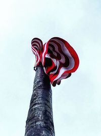 Low angle view of flag against sky