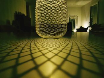 Close-up of illuminated object on floor at home