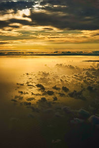 Scenic view of beach against sky during sunset