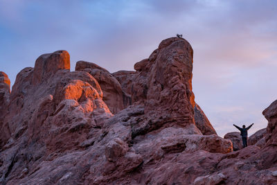 Low angle view of rock formation against sky