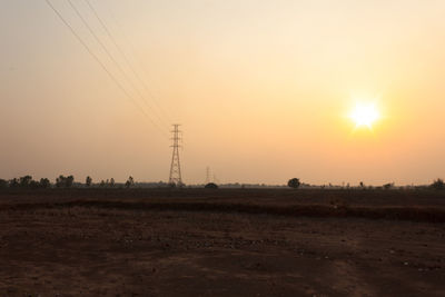 Scenic view of field against sky during sunset