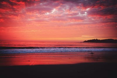 Scenic view of sea against dramatic sky