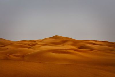 Scenic view of desert against clear sky