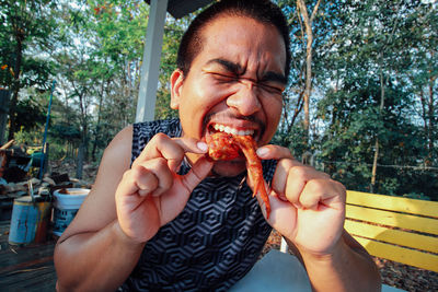 Cropped hand of woman holding food