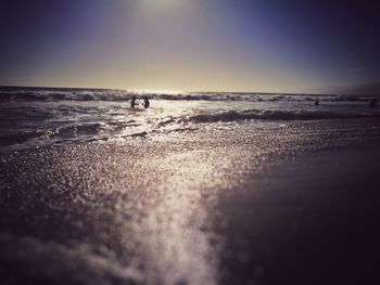 Scenic view of beach against clear sky