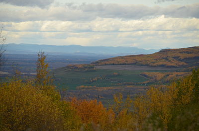 Scenic view of landscape against sky during autumn