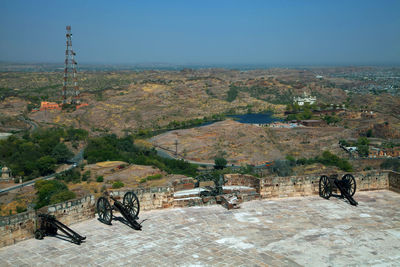 High angle view of cannons at mehrangarh fort against clear blue sky