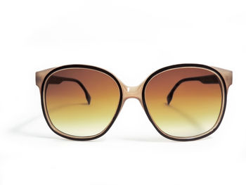 Close-up of sunglasses against white background