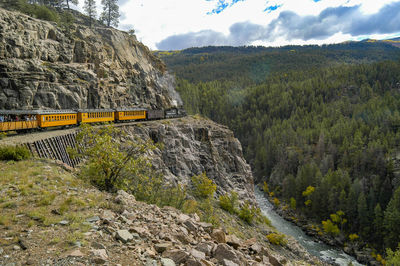 Train passing through rocks