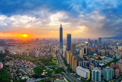 High angle view of city buildings during sunset