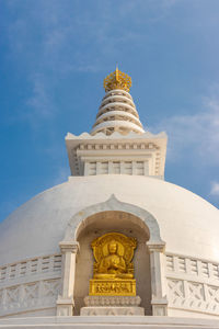 Buddhist stupa isolated with amazing blue sky from unique perspective