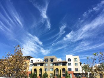Low angle view of building against cloudy sky