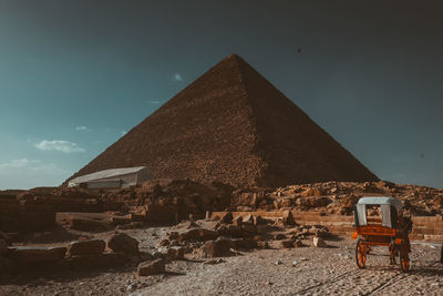 Built structure on sand against sky