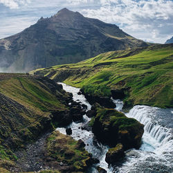 Scenic view of stream flowing through rocks