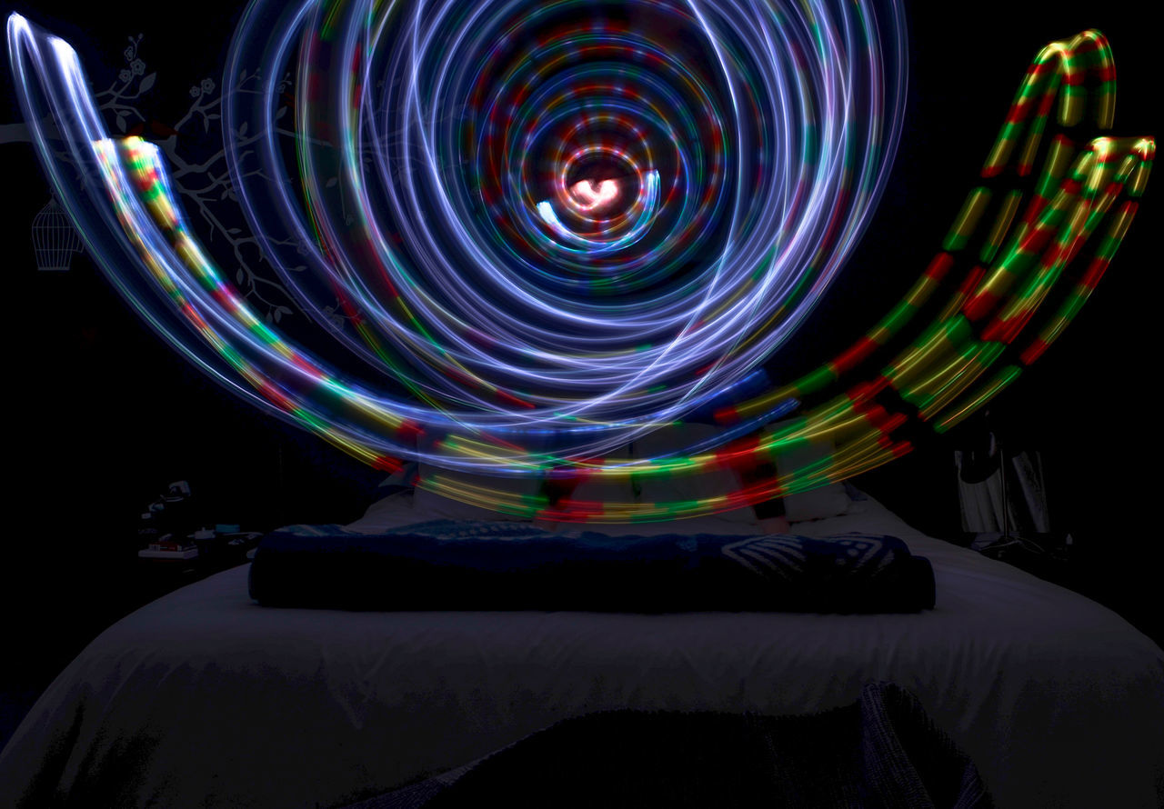 long exposure, multi colored, motion, night, illuminated, black background, light trail, light, spinning, circle, geometric shape, blurred motion, speed, glowing, abstract, vortex, spiral, screenshot, pattern, shape, light - natural phenomenon, light painting, space, no people, concentric