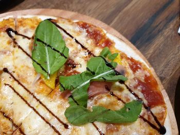 High angle view of pizza in plate on table