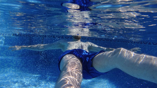 Low section of man in swimming pool