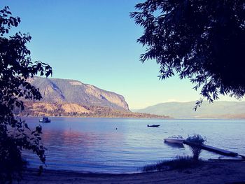 Scenic view of lake against sky at sunset