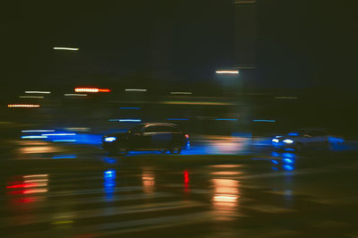 Illuminated city street at night