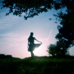 Woman standing on grass